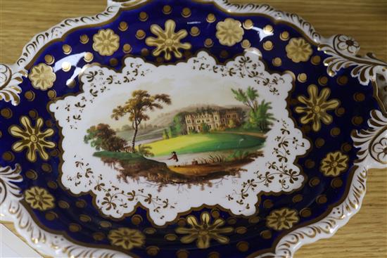 A Staffordshire dessert service, decorated in cobalt blue and gilt and painted topographical scenes